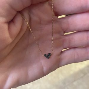 Kendra Scott fine jewelry 14k gold and black diamond heart pendant.